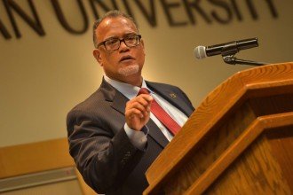 WMU President Edward Montgomery speaking at the podium during Fall Convocation 2017.