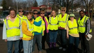 WMU PSSO members post in reflective yellow MDOT vests.
