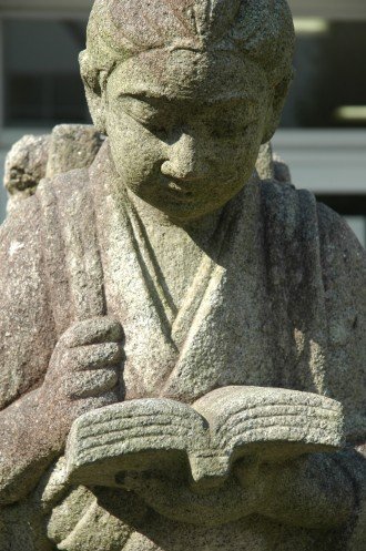 Statue of girl reading a book
