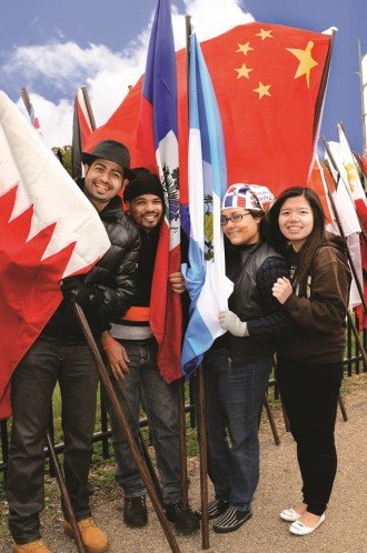 Photo of WMU students holding international flags