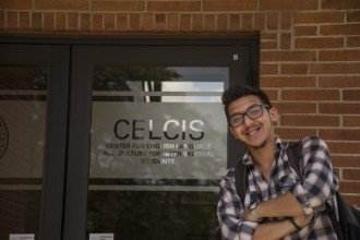 CELCIS student takes a moment to pose for a photo while leaving the CELCIS office.