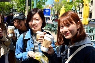 Exchange students enjoy coffee at a local cafe.