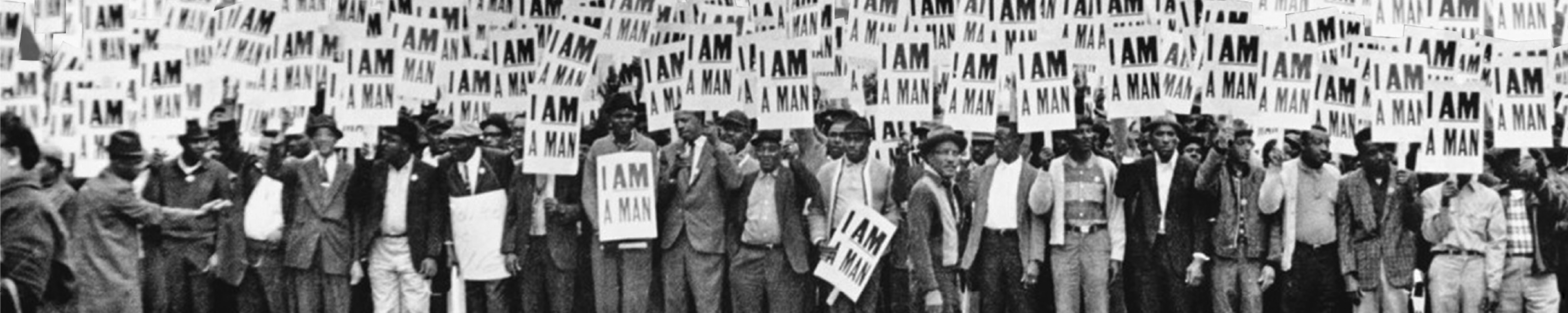 Men protesting during the Memphis sanitation workers strike, holding signs that read, I am a Man