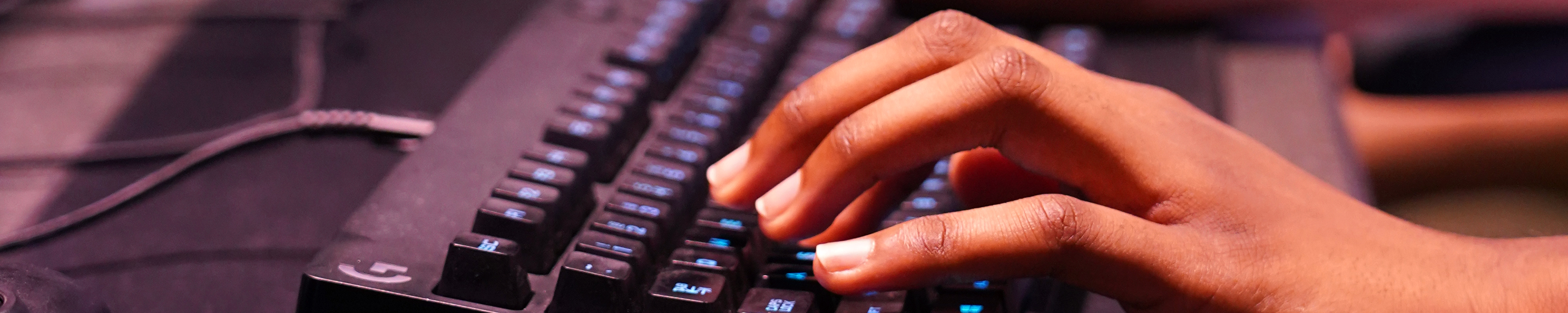 Close up of hand typing on keyboard