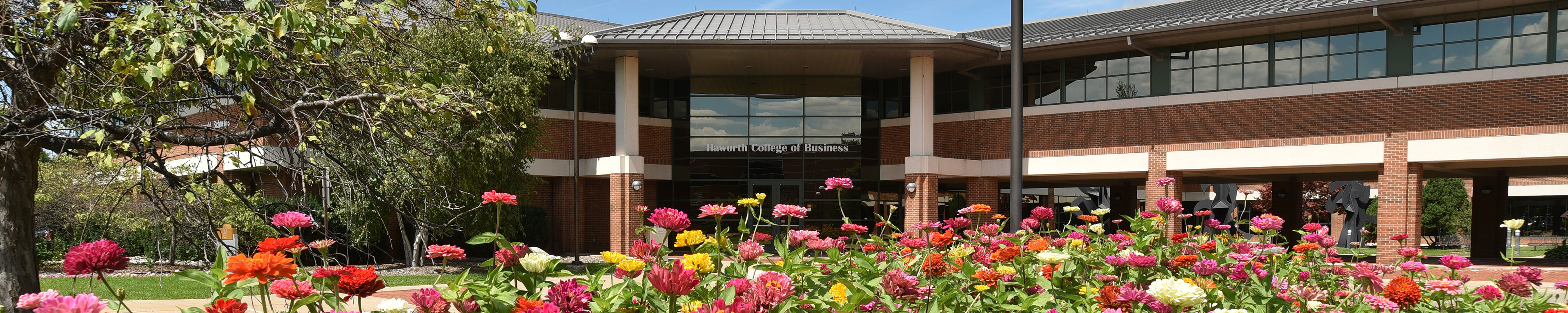 A spring day outside the Haworth College of Business with flowers in bloom.