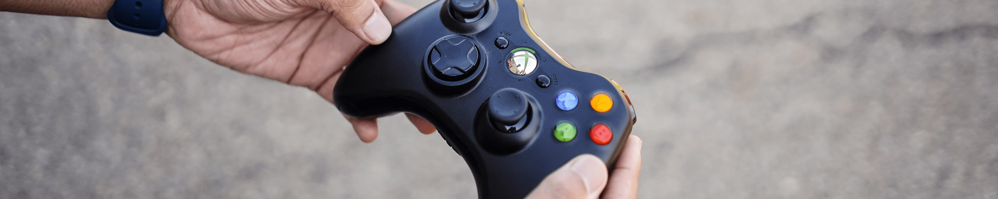 A game controller in a student's hand