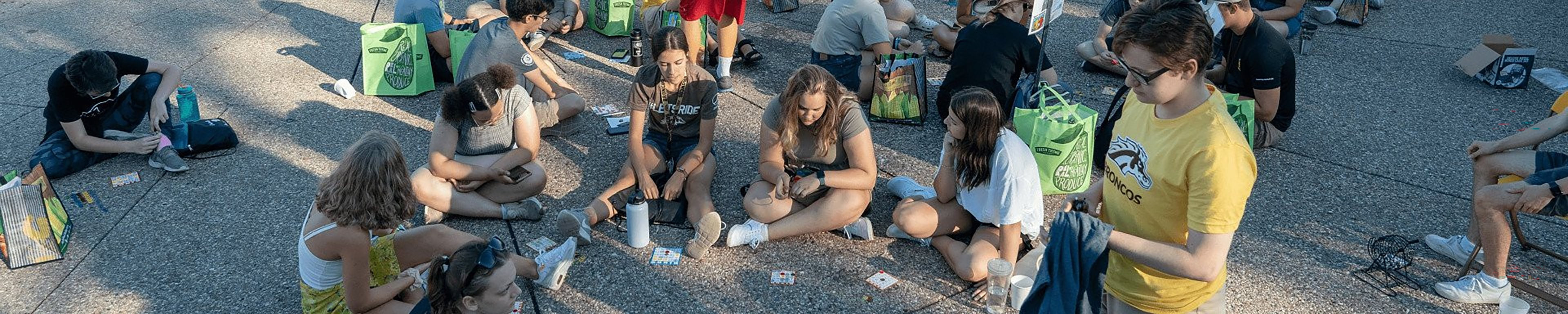 Students playing bingo outdoors