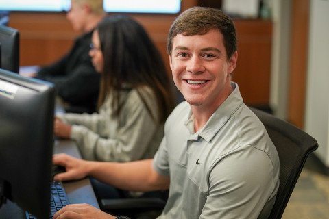 Business student sitting in a computer lab.