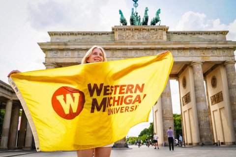 Student with flag in Germany.