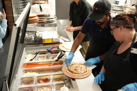 Students working at the WMU Student Center's Mi Pi pizza restaurant.