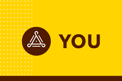The word "YOU" on a yellow background with a triangular graphic to the left.