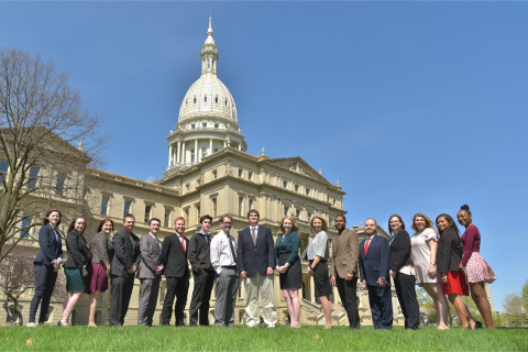 Students standing in front of capitol building in Lansing