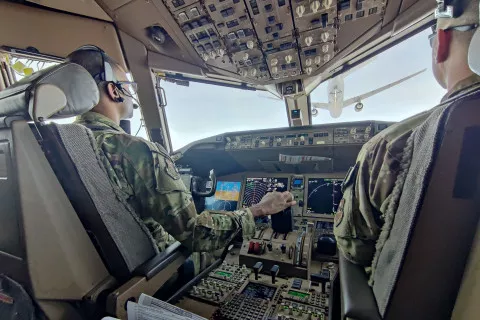 Joel Webley sitting in the cockpit of an Air National Guard plane.