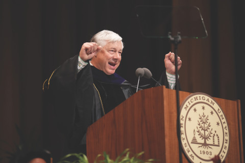 Fred Upton celebrating at the podium at commencement.
