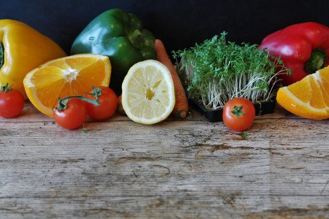 Fruits and vegetables displayed on a wooden counter