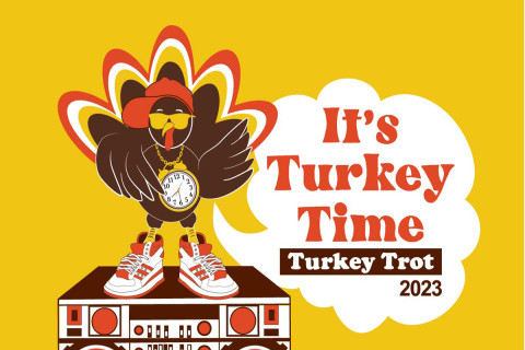 Turkey Trot logo with turkey standing on a boom box saying it's Turkey Time