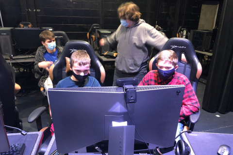 Kids at Esports terminal learning a gaming session