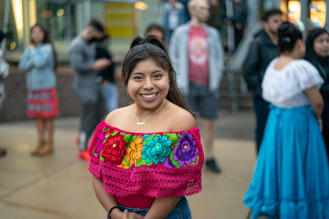 Female student attends El Grito on campus