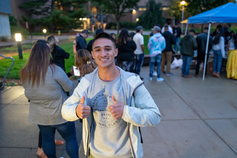 Male student attends El Grito on campus