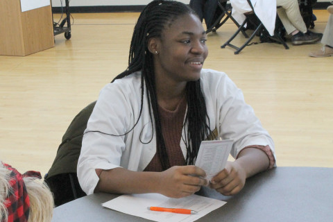 Nursing student at a table
