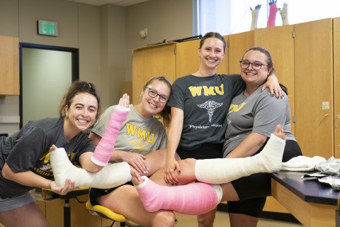 PA students learning how to apply casts to one another