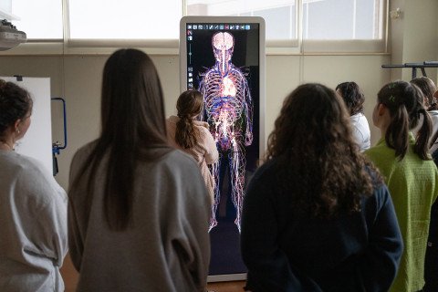 Students gathered around the Anatomage Table