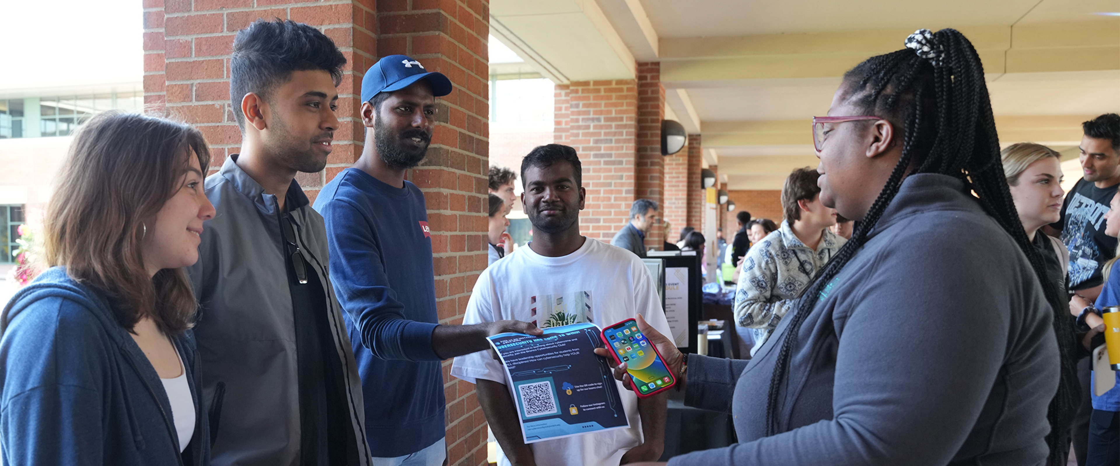 Cybersecurity students advertising their RSO at Business Bash.