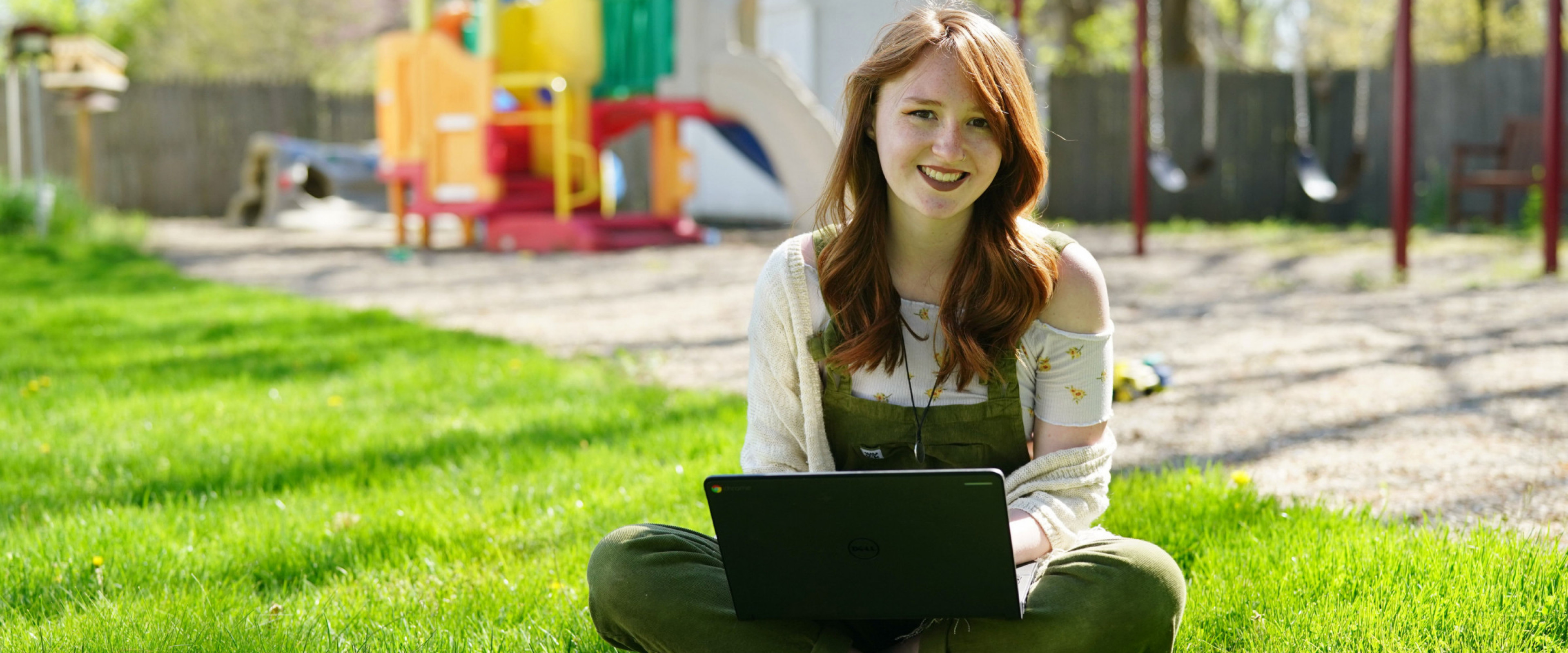 Kirstin with a laptop at a park