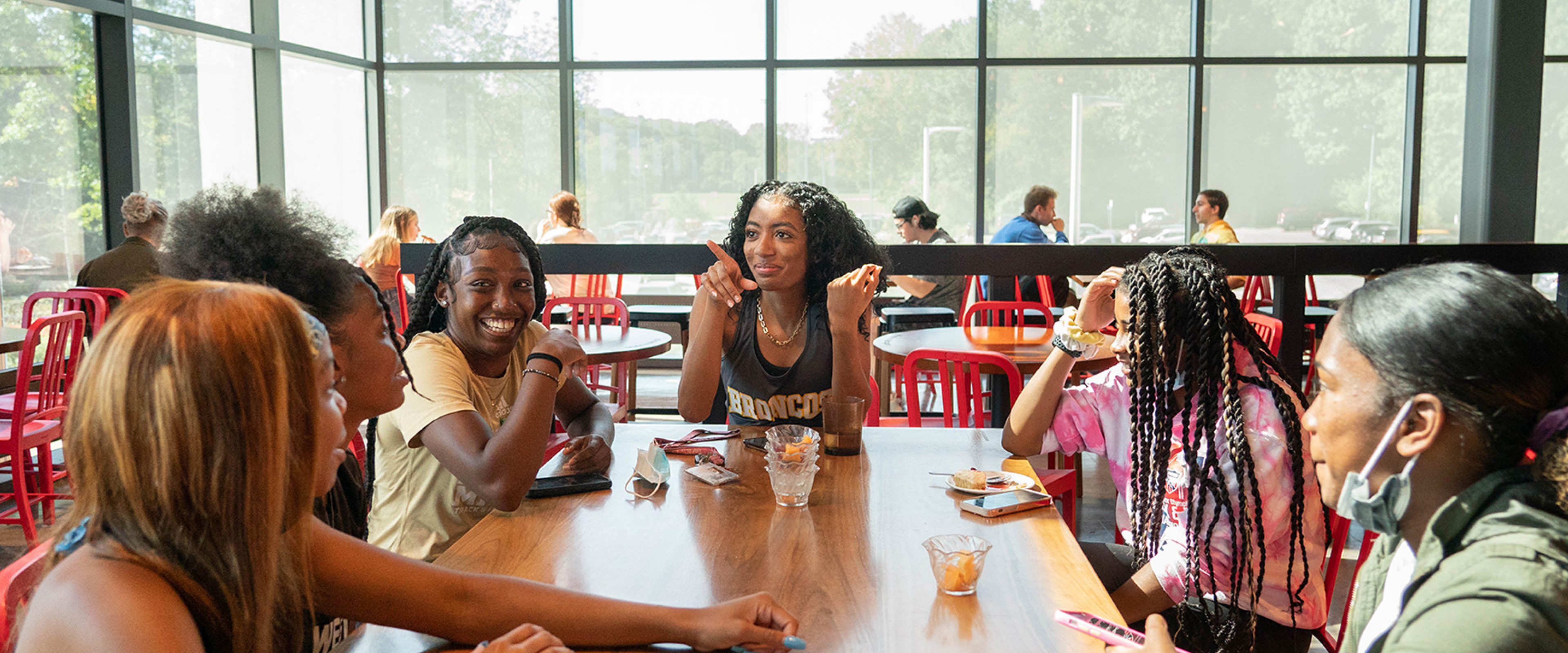 Group of students at Valley Dining Center enjoying a meal with friends.