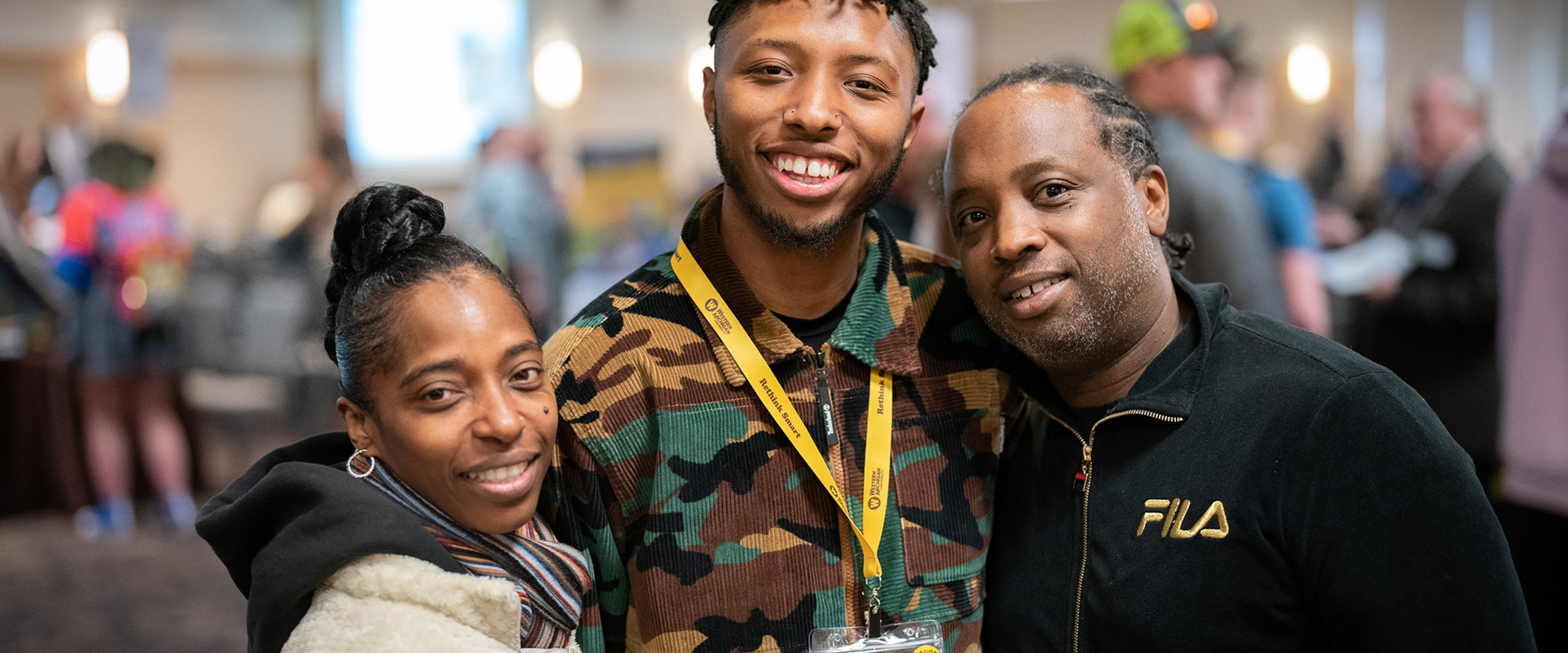 Student with his parents at an admitted student event.