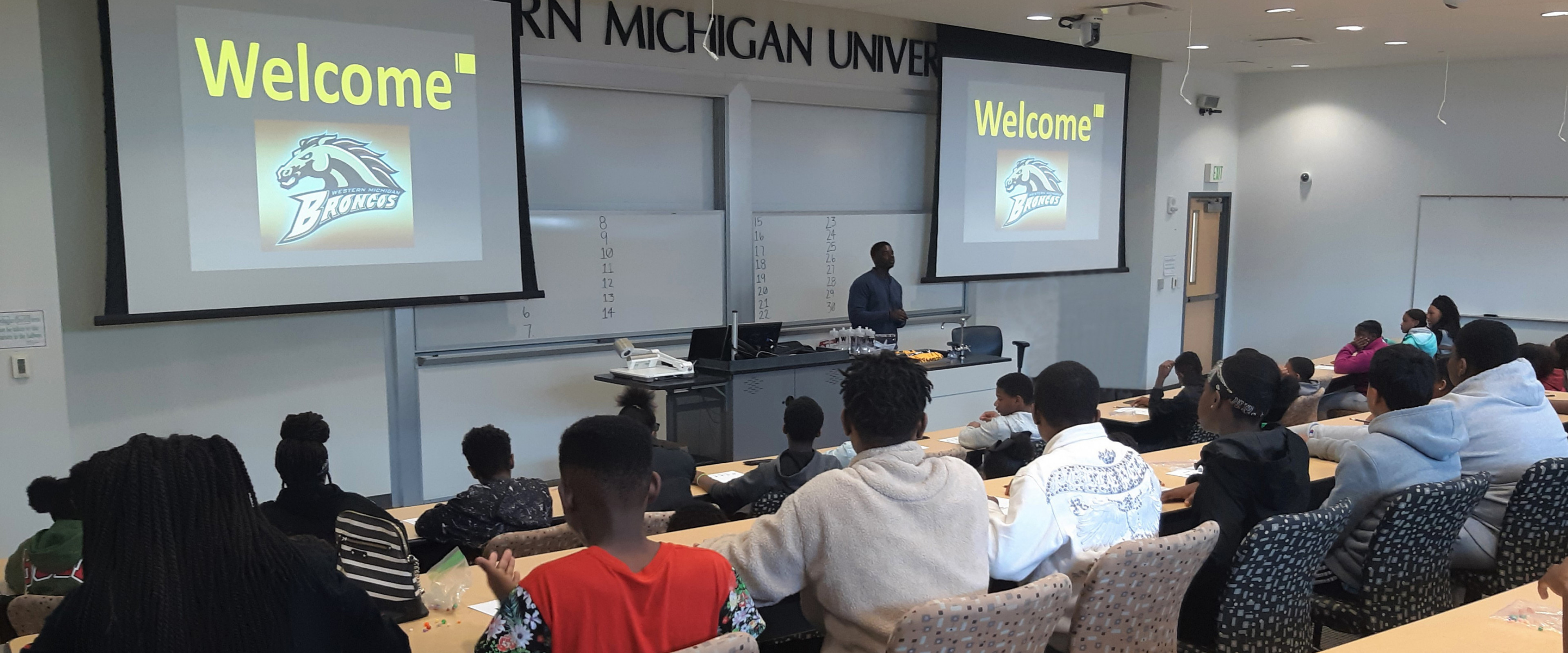 Students watching a WMU admissions presentation