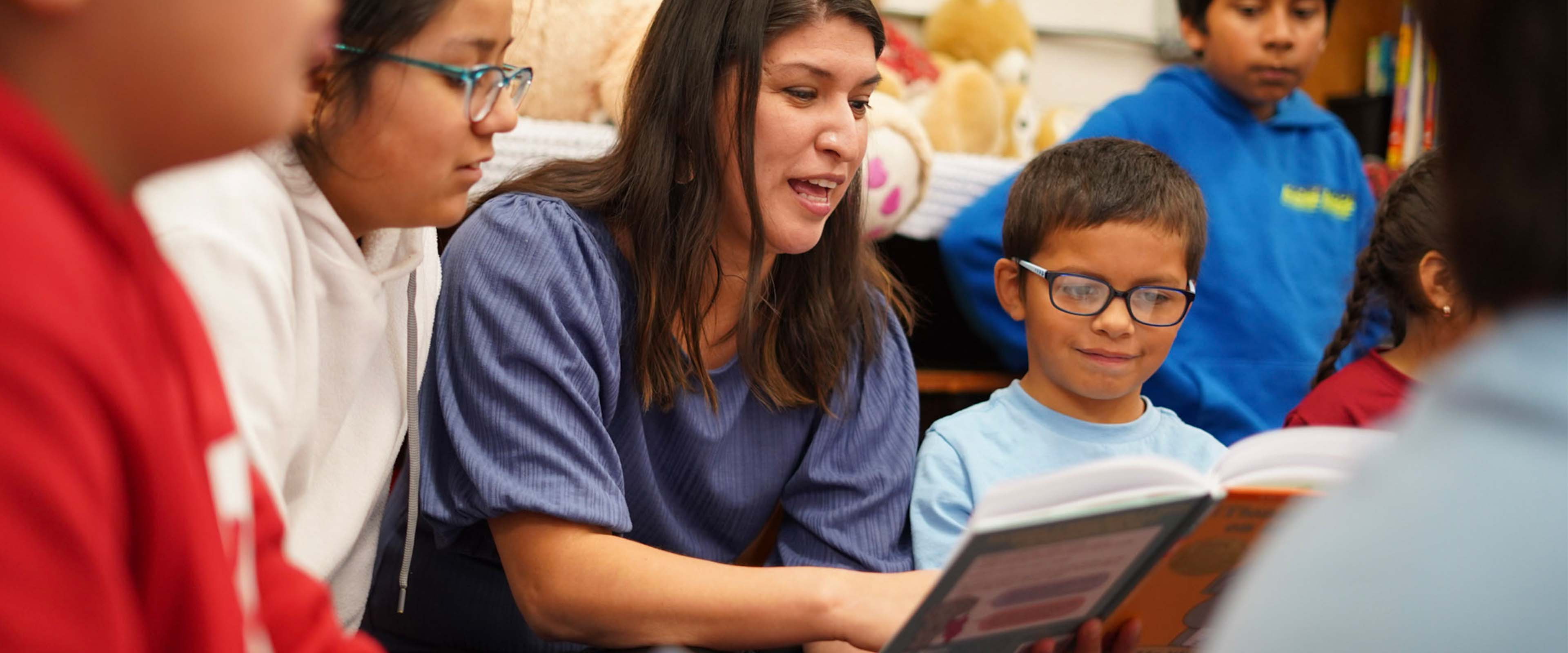 A teacher reading to her students.
