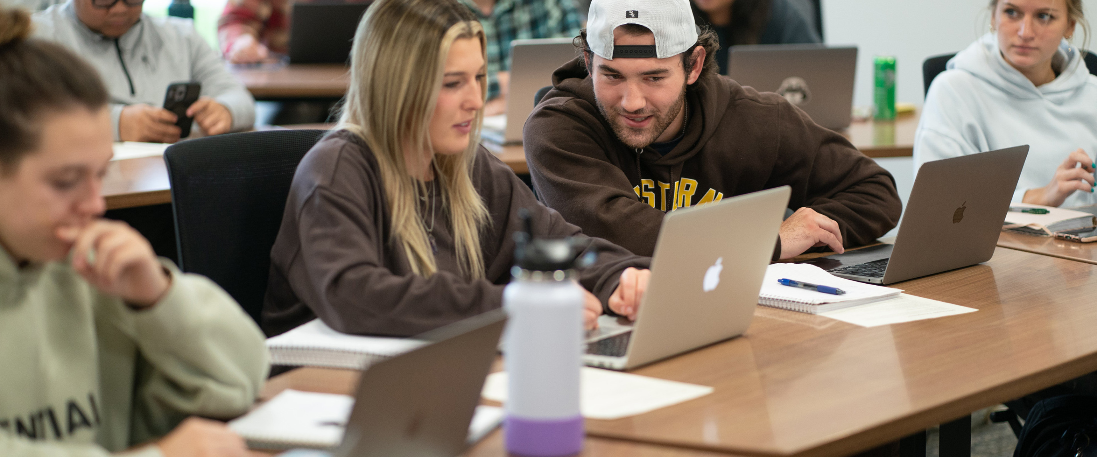 Photo of students working together in a marketing class