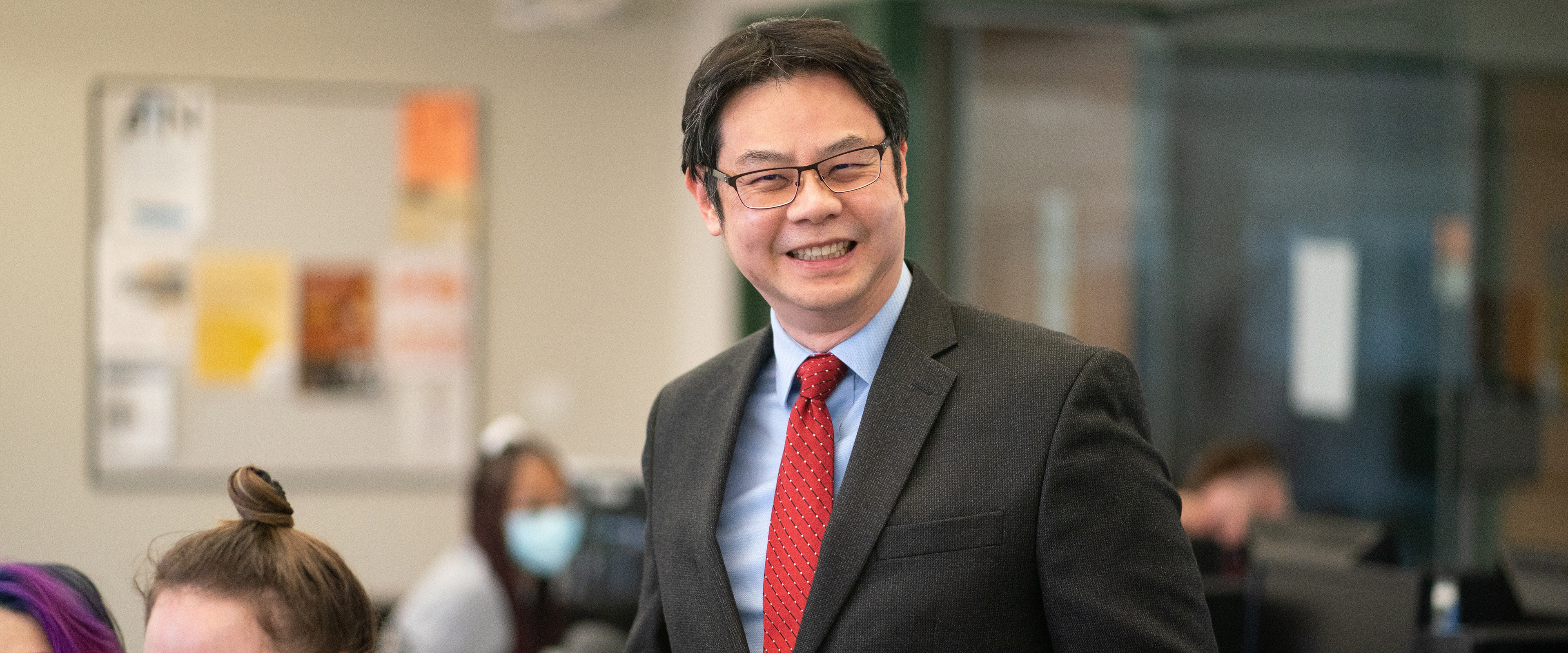 Dr. Kuanchin (KC) Chen, professor of business information systems, smiles while teaching his class.