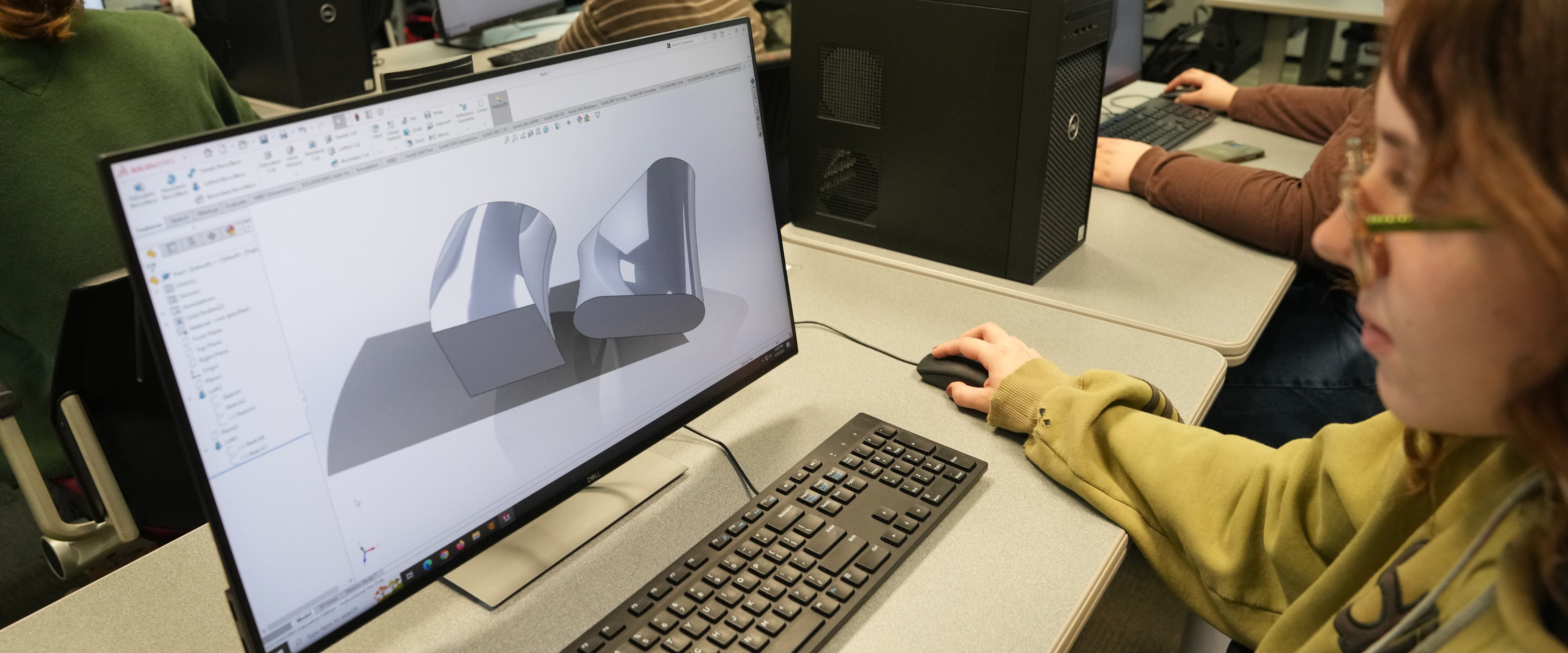Student working with modeling software at computer station