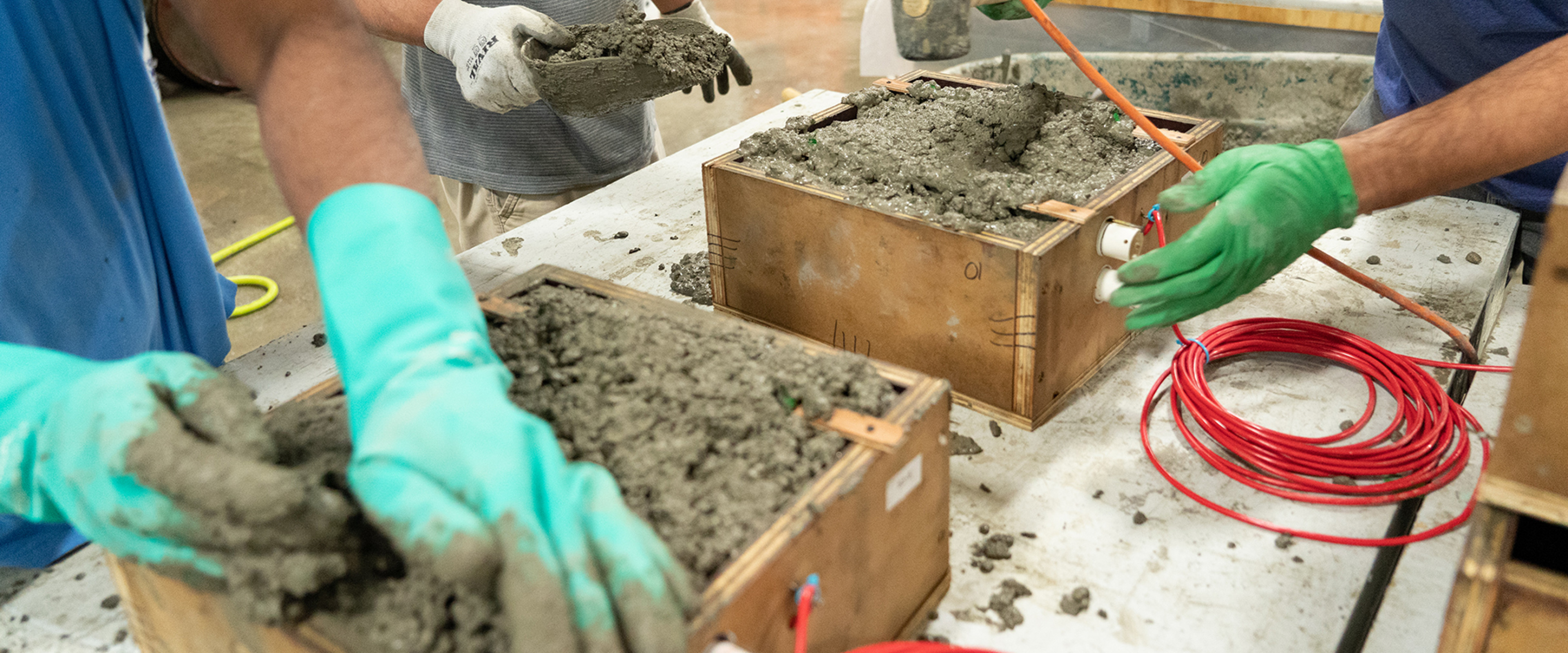 students testing concrete in one of the labs