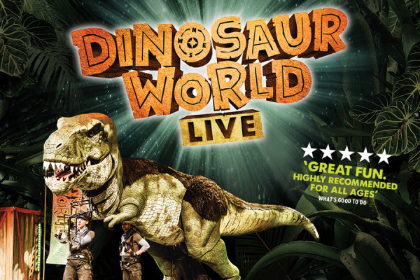 Dinosaur puppet on stage under the Dinosaur World Live Logo