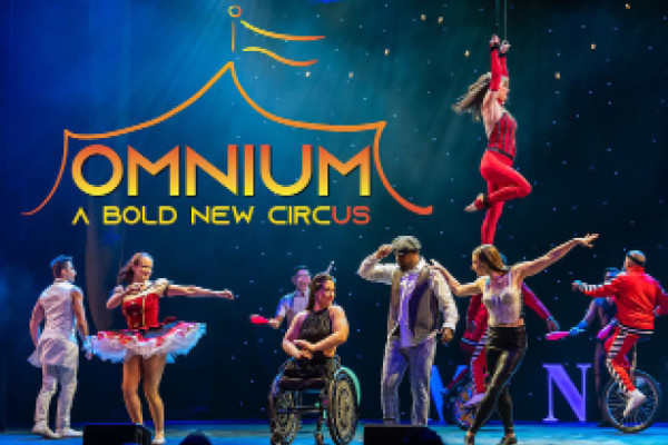 More of the performers on stage with Omnium logo