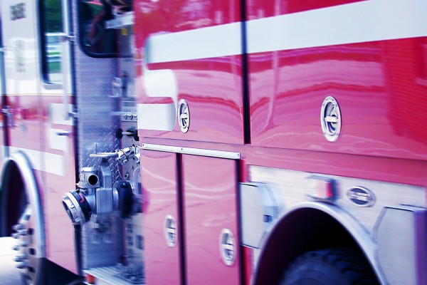 The broadside of a firetruck is shown. 