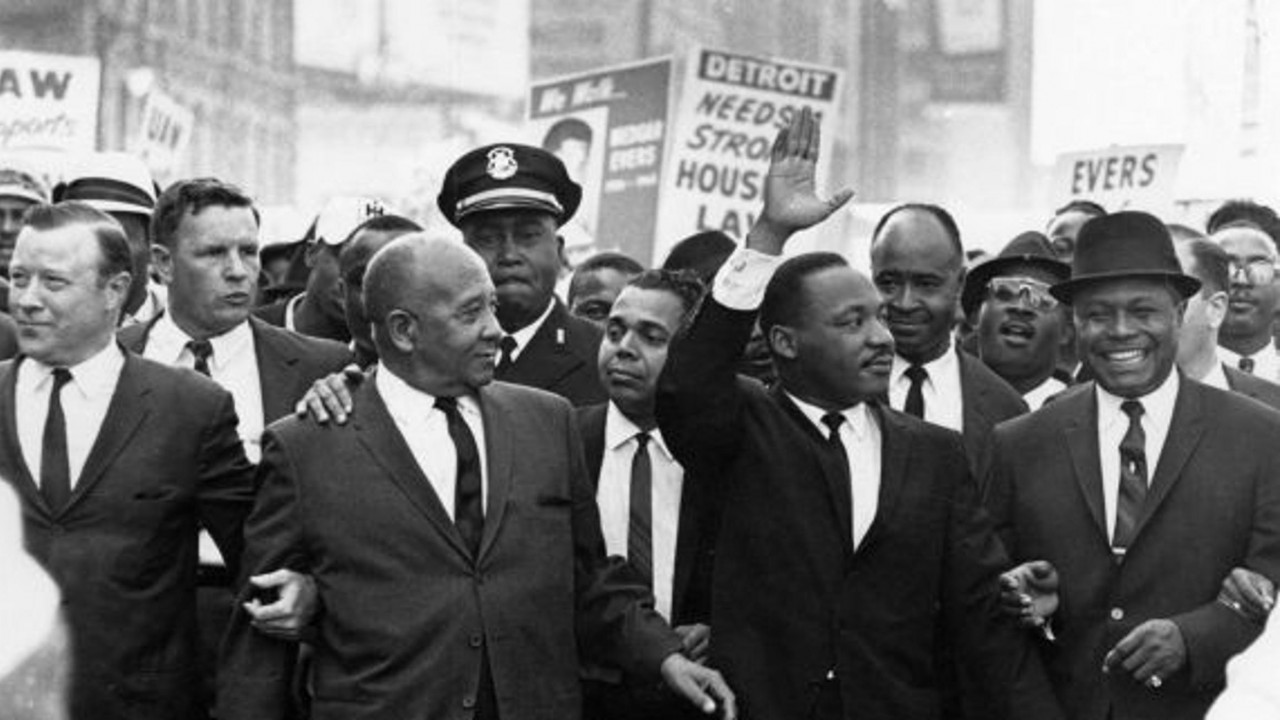 Martin Luther King Jr. marches with other people of color