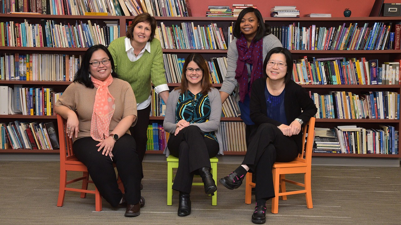 staff posing in the library