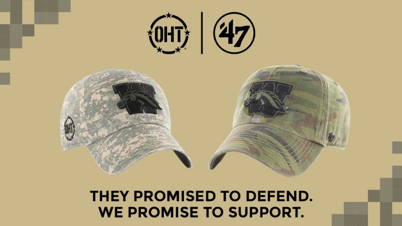 Two variations of last year's Operation Hat Trick hats, along with text that reads: "They promised to defend. We promise to support." The hats are different types of camouflage and feature WMU's logo.