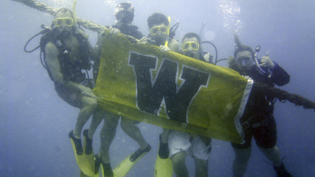 WMU students scuba diving abroad.