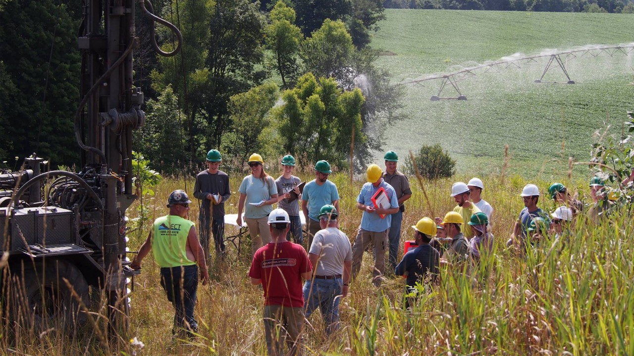 Students in the Hydrogeology Field Course at a hands-on demonstration in the field.