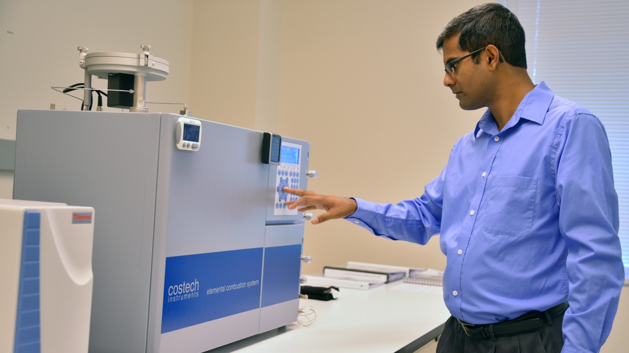Dr. thakurta operates machinery in his lab.