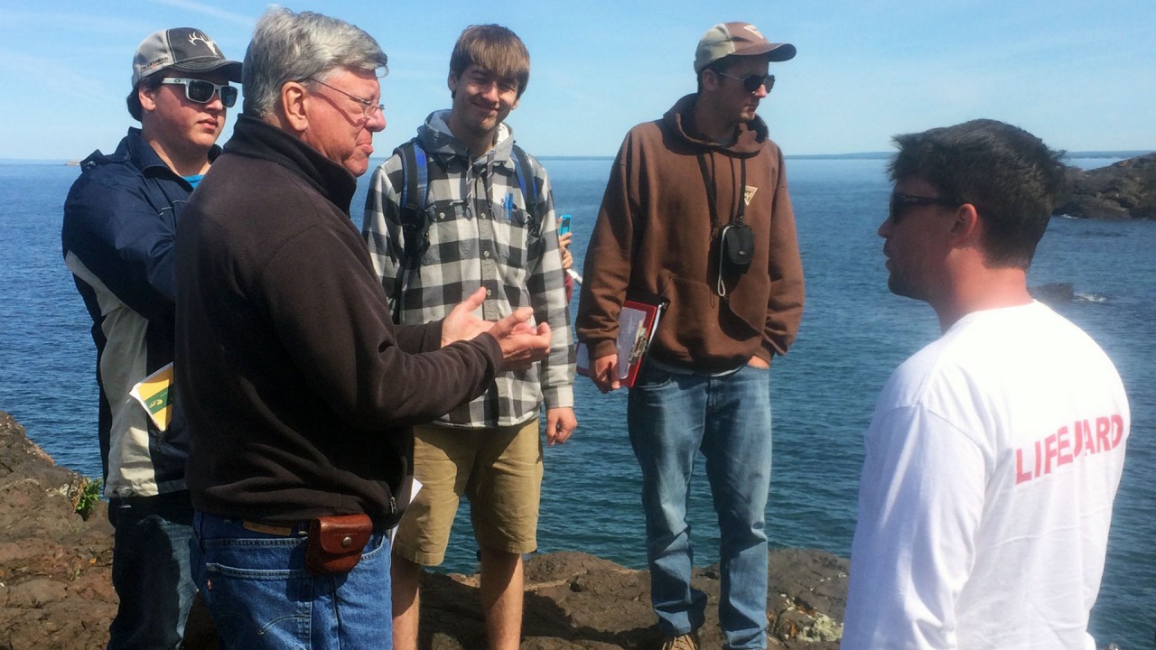 Dr. Gillespie leads a discussion in the field