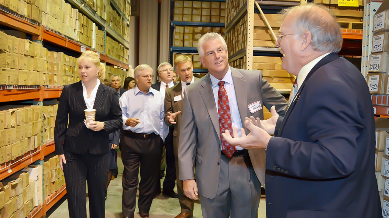 Dr. Harrison guides a tour of industry and govement members through MGRRE
