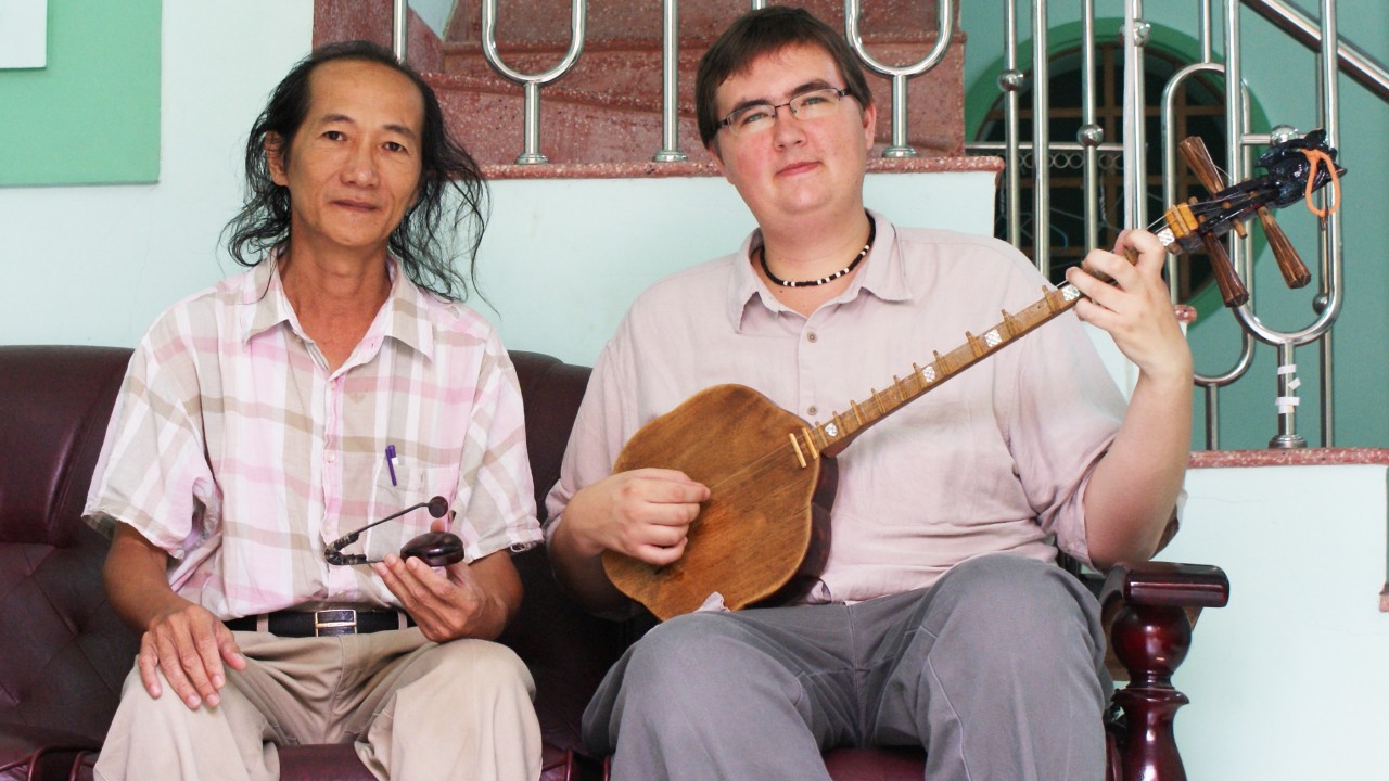 Dr. Alexander Cannon with Vietnamese musician