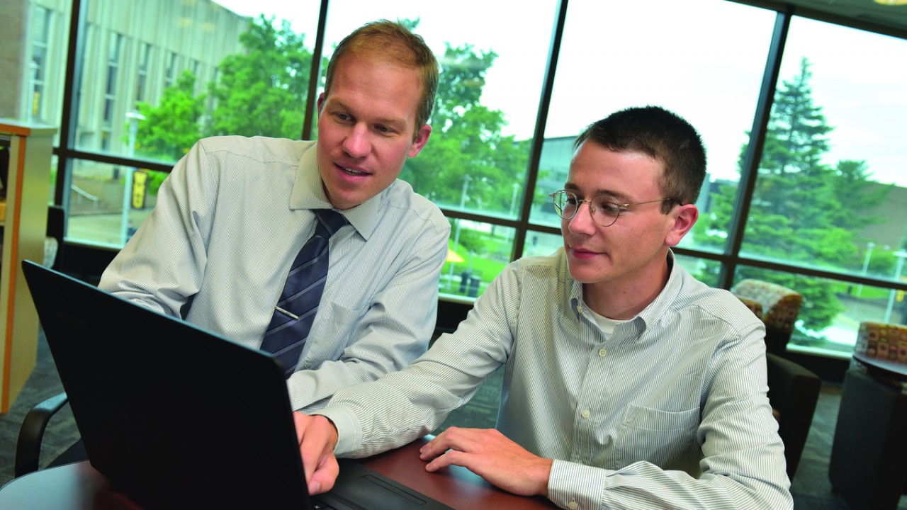 Dr. Brian Gogan and Luis Pena, student developer of the Geo-map for WMU,