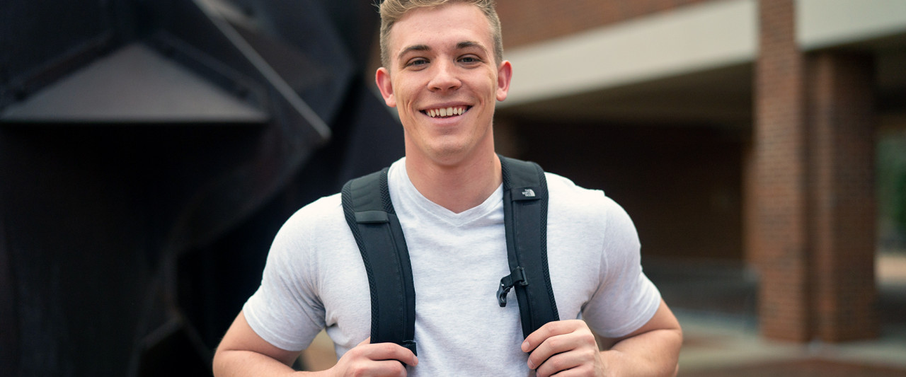 Student smiling with backpack